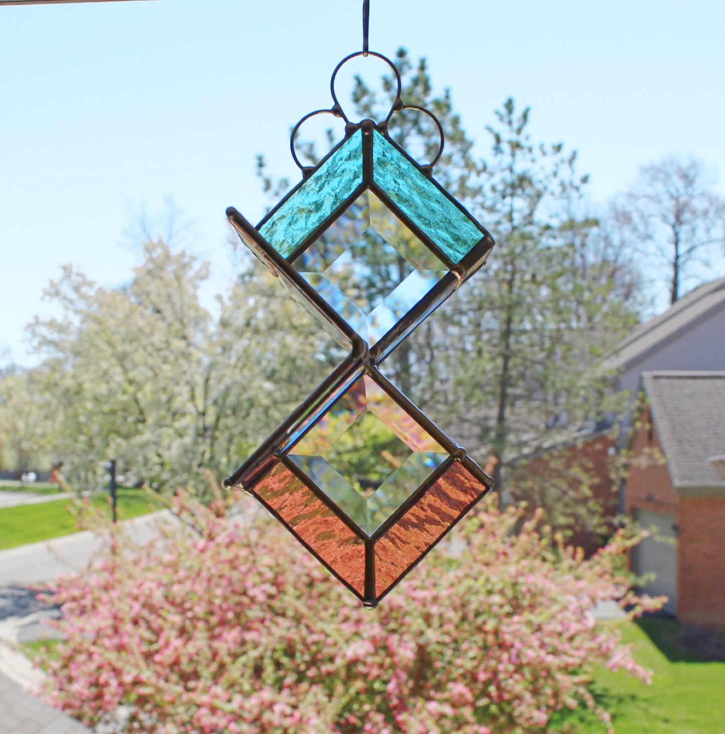 Stained Glass Spinner. Hanging beveled glass creates prisms with sunshine. Pastels.