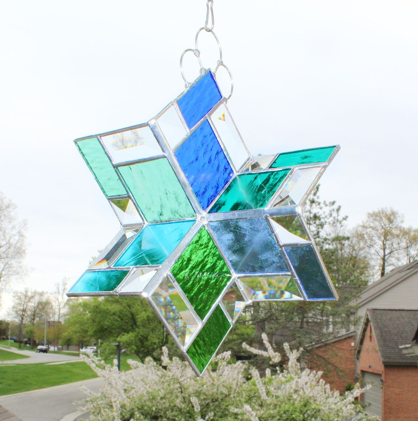 Stained Glass Spinner. Hanging beveled glass creates prisms with sunshine. Blues & Greens