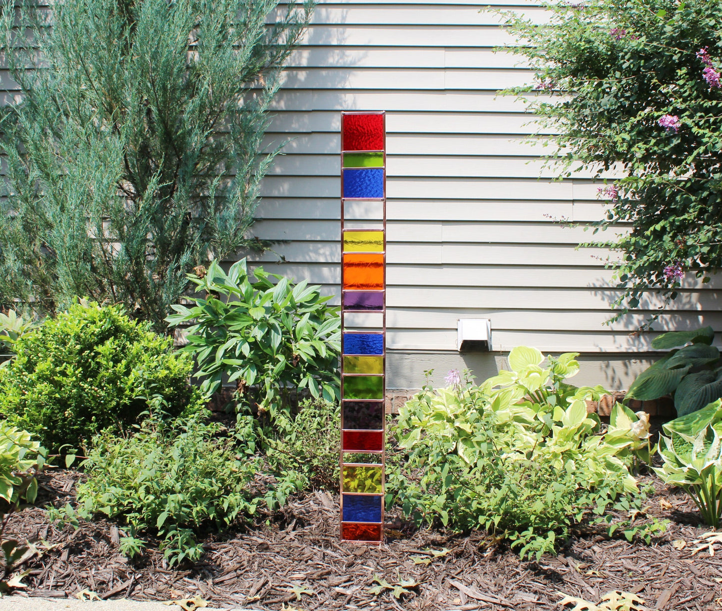 Tall Glass Garden Sentry Stake. 44” copper framed statement yard décor. Rainbow primary.