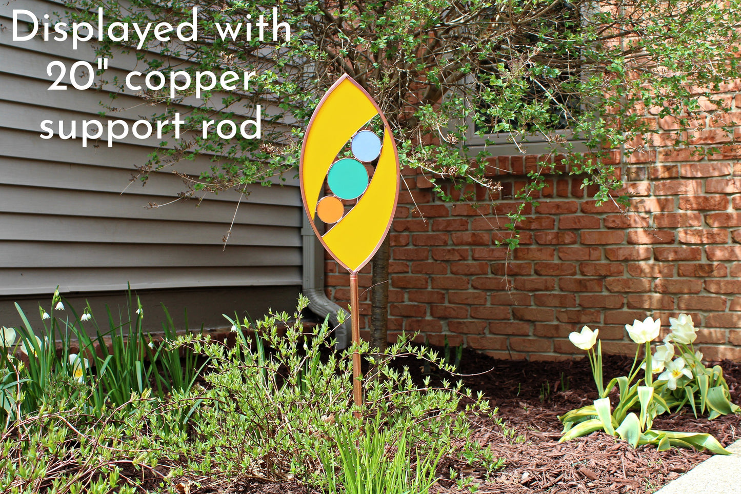 Ellipse shaped glass garden art stake. Marigold. Copper framed. Opaque glass.