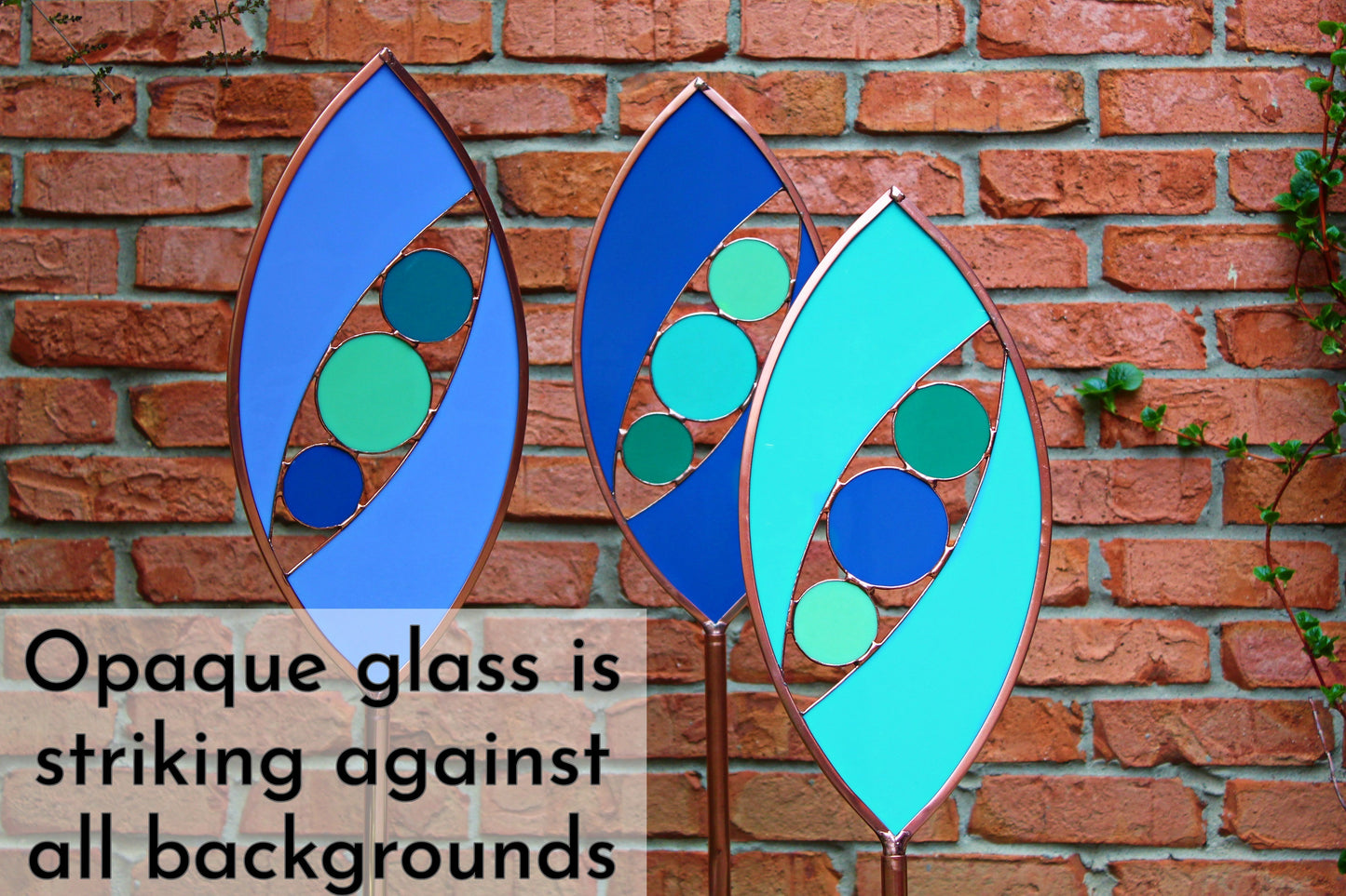 Ellipse shaped glass garden art stake. Turquoise Green. Copper framed. Opaque glass.
