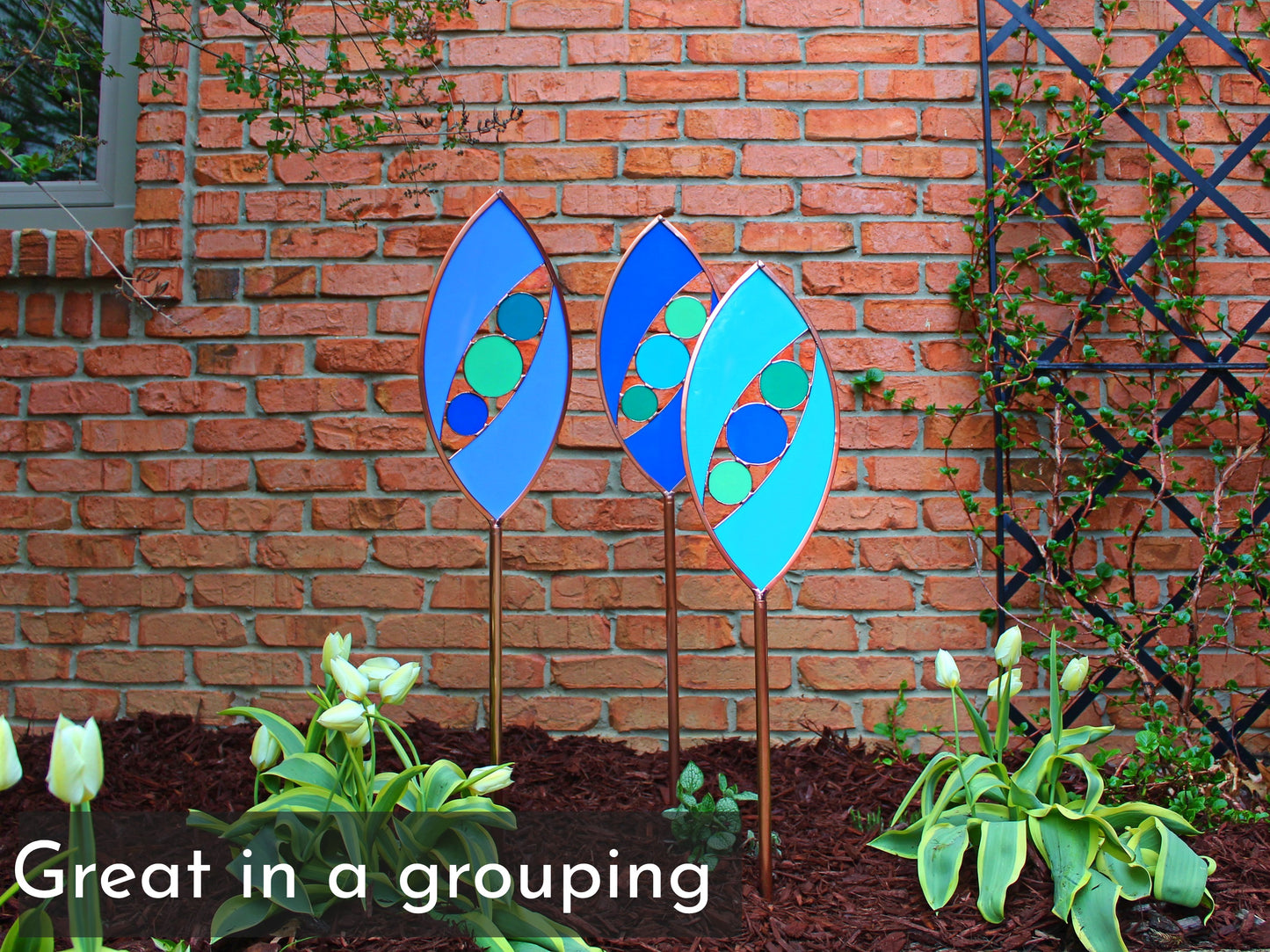 Ellipse shaped glass garden art stake. Hydrangea Blue. Copper framed. Opaque glass.