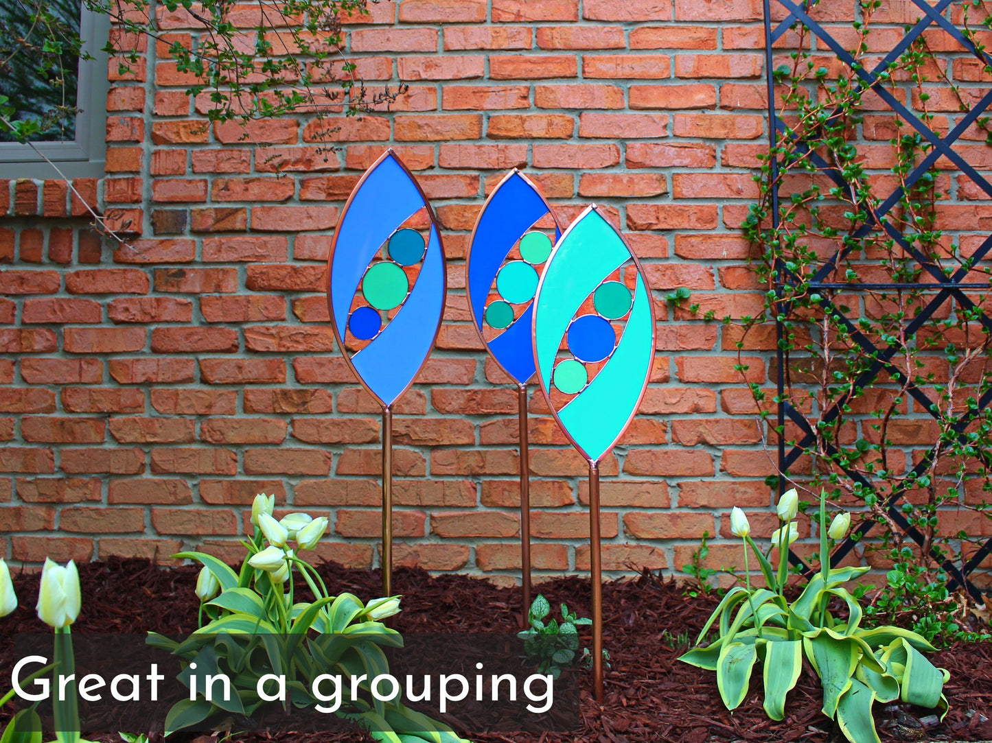 Ellipse shaped glass garden art stake. Turquoise Green. Copper framed. Opaque glass.