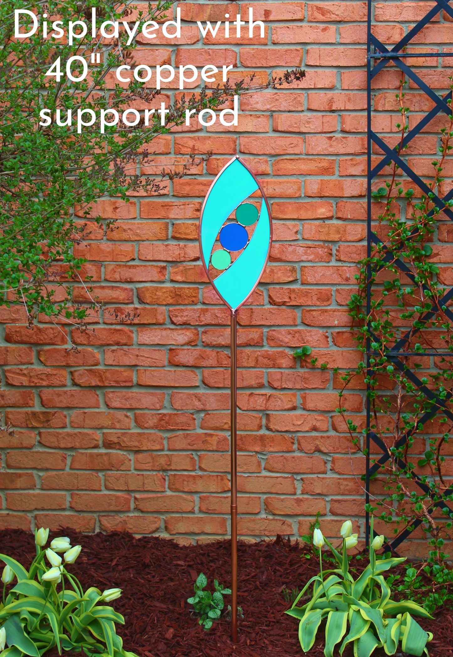 Ellipse shaped glass garden art stake. Turquoise Green. Copper framed. Opaque glass.