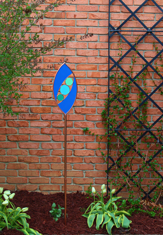 Ellipse shaped glass garden art stake. Mariner Blue. Copper framed. Opaque glass.