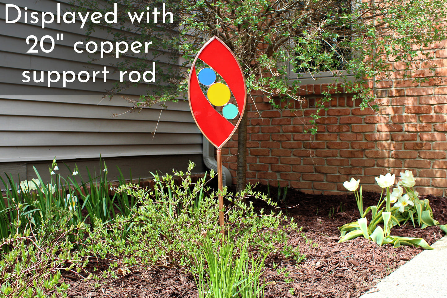 Ellipse shaped glass garden art stake. Red. Copper framed. Opaque glass.